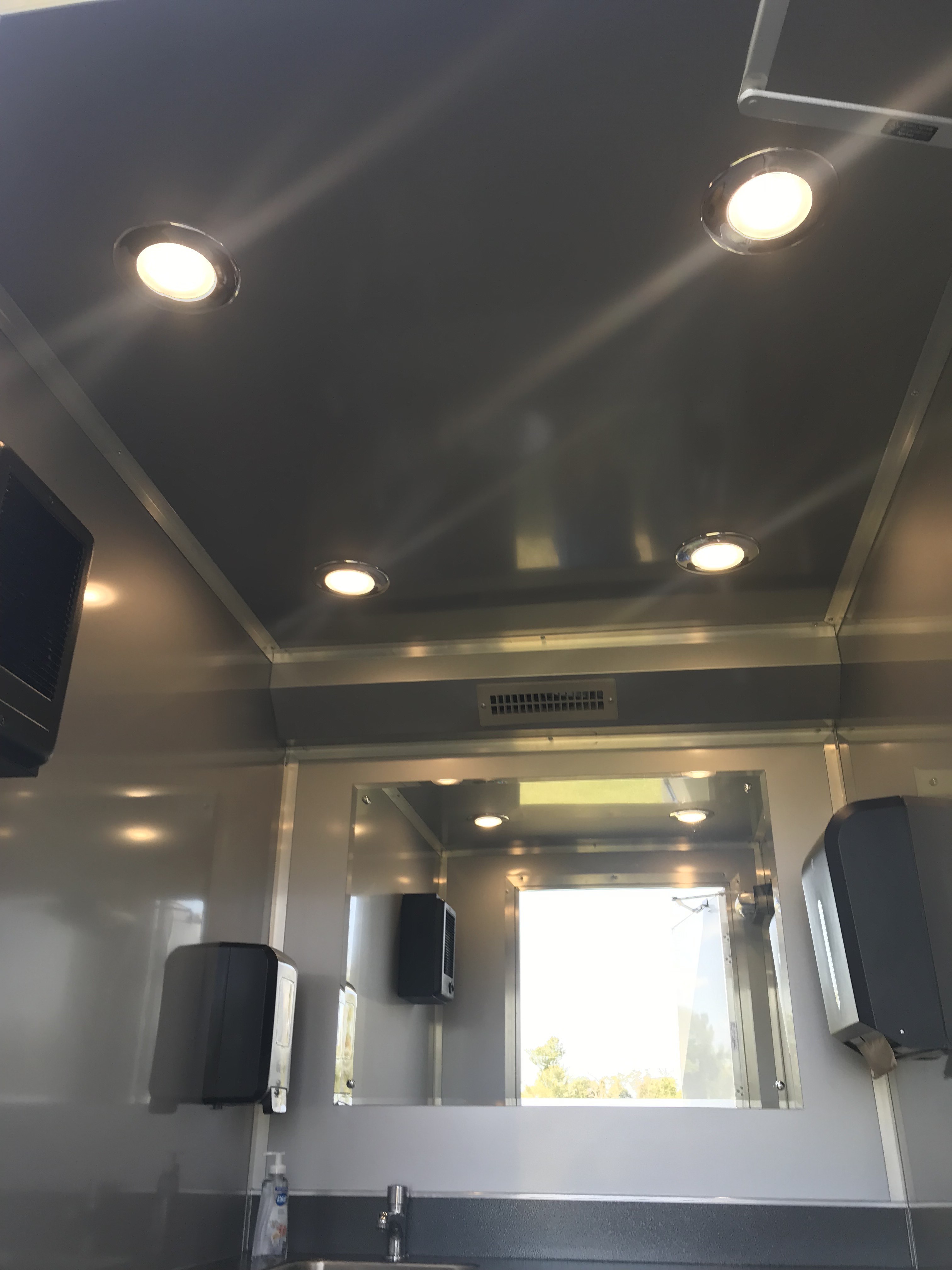 Restroom trailer multi‑station stainless interior